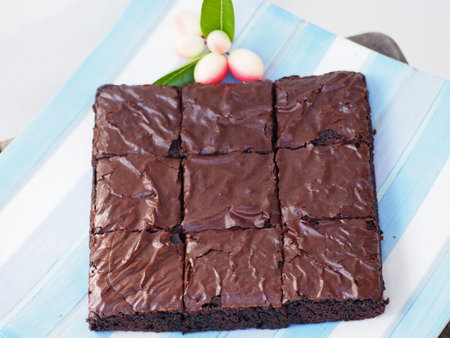 Chocolate brownies on a blue wooden background. Selective focus.の写真素材