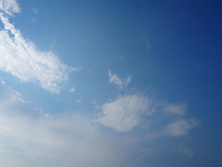 blue sky background with tiny clouds, soft focus, and copy spaceの写真素材