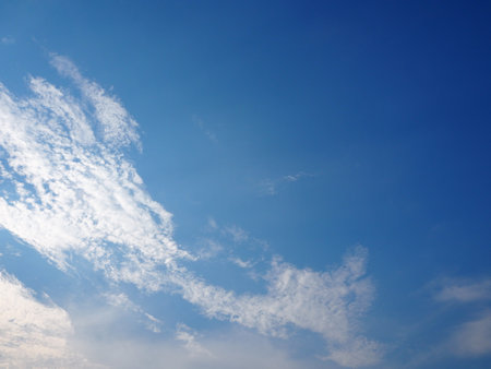 blue sky background with tiny clouds, soft focus, and copy spaceの写真素材