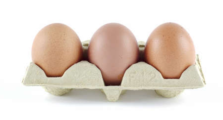 Strip of three eggs on egg cartons