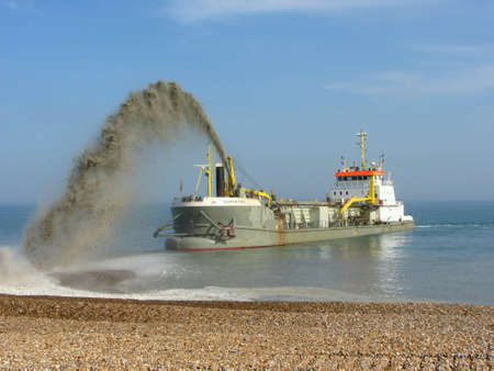 Dredger replenishing beach at Eastbourne, England, after Winter stormsの素材