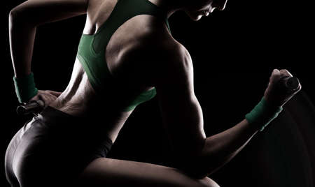 gymnast doing weights and sweatingの写真素材