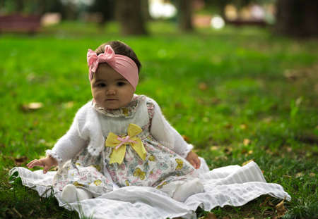 Baby Looking up Curiously Isolated on Whiteの写真素材