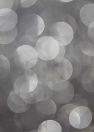 Christmas bokeh background with gray circlesの写真素材