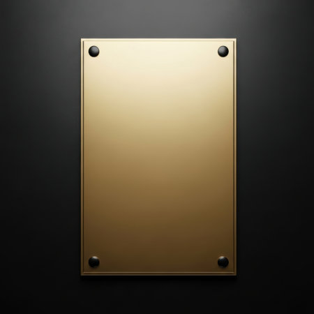 A rectangular golden plaque with a reflective, polished surface and four visible rivets. The plaque is mounted on a subtly textured dark surface, creating a sense of depth and sophistication.の素材