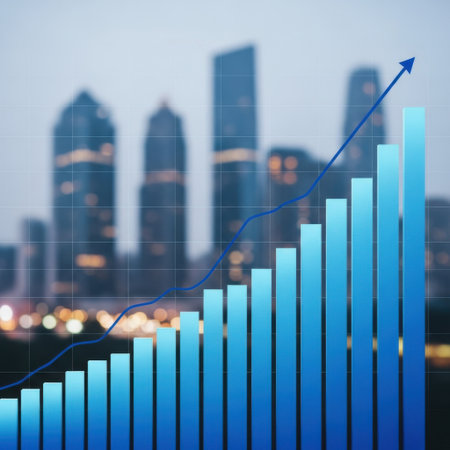 A blue bar chart showing an increasing trend superimposed on a blurred cityscape. This image represents financial growth, market progress, and economic prosperity in a modern urban environment.の素材