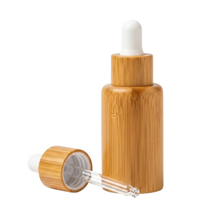 This image features a stylish bamboo dropper bottle, perfect for storing and dispensing essential oils, serums, cosmetics, and skincare products with a natural, eco-friendly aesthetic.の素材