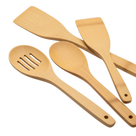 A collection of essential wooden cooking utensils including slotted and solid spoons, and spatulas, perfect for any home chef's kitchen needs and food preparation.の素材