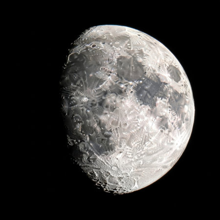 Experience the celestial beauty of the moon in this high-resolution image. Observe the intricate details of its surface, including craters, plains, and mountains, captured during a gibbous phase.の素材