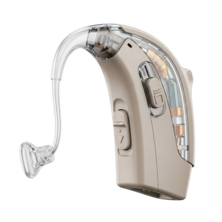 A detailed view of a beige and transparent behind the ear hearing aid with its clear tubing and ear tip, isolated on a white background.の素材