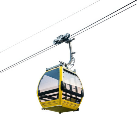 A single yellow cable car hangs from a cable, isolated on a clean white background.の素材