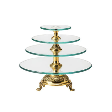 A decorative four-tiered glass serving stand with an intricate golden base, presented isolated on a clean white background.の素材