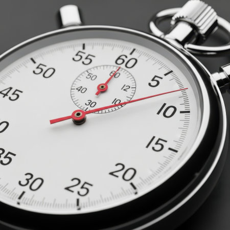Detailed view of a classic stopwatch face, showcasing its intricate mechanism and clear markings for accurate timekeeping. A symbol of precision and historical measurement.の素材