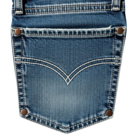 A close-up shot showcasing the textured blue denim fabric of a jeans back pocket. Detailed stitching and metal rivets highlight the garment's construction and design elements.の素材