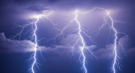 Multiple bright lightning strikes crackle across a dark, cloudy sky, creating a powerful and awe-inspiring natural display.の素材