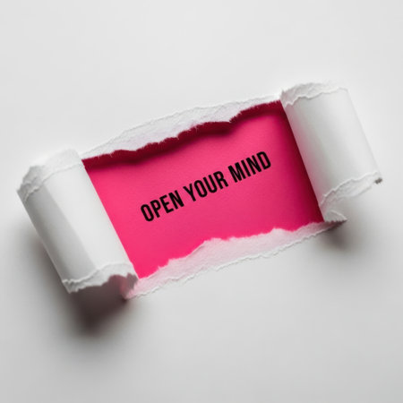 A torn paper revealing a vibrant pink surface with the motivational phrase 'OPEN YOUR MIND'. This image symbolizes breaking through limitations and embracing new ideas and possibilities.の素材