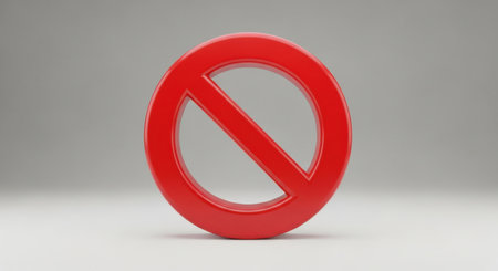 A bright red prohibition symbol, signifying restriction or prohibition, is presented isolated on a clean white background.の素材