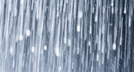 A close-up abstract view of vertical lines with varying shades of blue and white, suggesting movement and depth.の素材