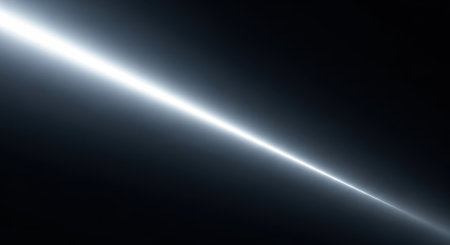 A brilliant white light streak with a lens flare effect emanates diagonally across a dark, transparent background.の素材