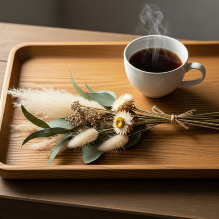 A warm cup of steaming coffee rests beside a charming dried flower bouquet on a smooth wooden tray. Perfect for a peaceful morning moment.の素材