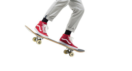 A dynamic shot showcasing a skateboarder's lower body in motion, presented cleanly on a white background.の素材