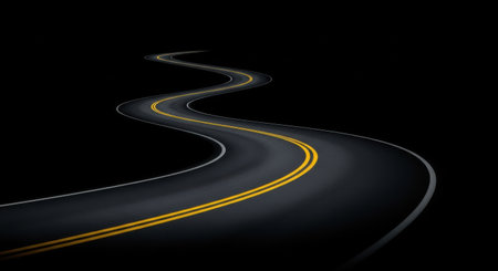 A dark, winding road with yellow lines stretches into the distance, illuminated by faint lights. The road curves gracefully, disappearing into the darkness, creating a sense of mystery and adventure.の素材