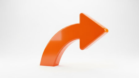 The image depicts a bright orange arrow pointing to the right. The arrow has a smooth, glossy finish and is set against a plain white background. The arrow's design is simple and modern, with a slight curvature to its shape.の素材