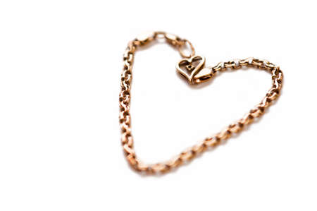 Gold coulomb in the form of heartの写真素材