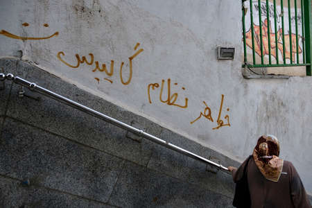 Curse words and vulgar speeches written with spray against the regime by protesters in Iranの写真素材