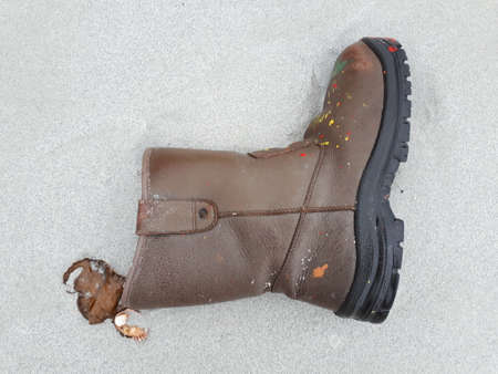 One boots were left on the sandの写真素材
