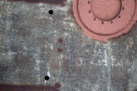 rusty sheet with manholeの写真素材