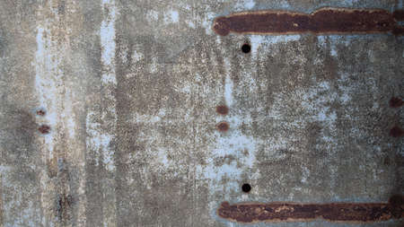 rusty metal sheet with holesの写真素材