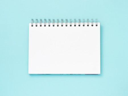 Top view of blank note paper blue wood table for background