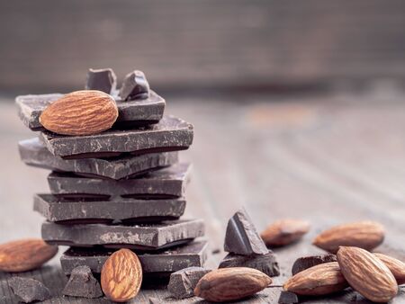 Stack of chocolate and almond with copy spaceの写真素材