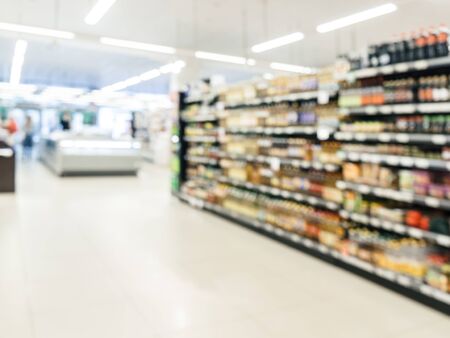 Blurred colorful supermarket products on shelvesの写真素材