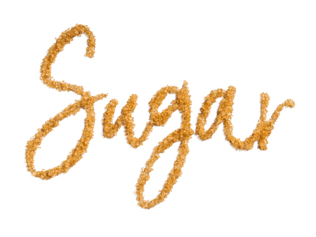 word sugar from brown sugar. Isolated on white with clipping path.の写真素材