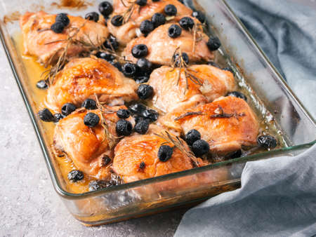 Corsican chicken thighs with rosemary and black olivesの写真素材