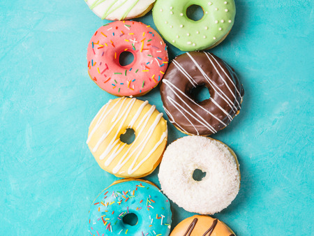 donuts on blue background, top viewの写真素材