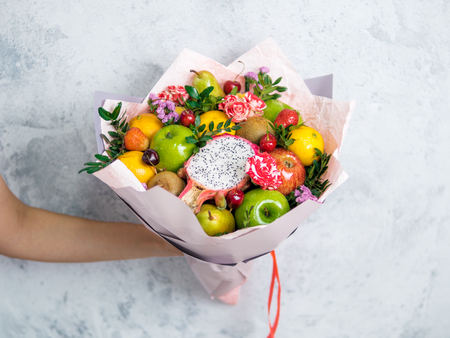 Eating bouquet in female handsの写真素材