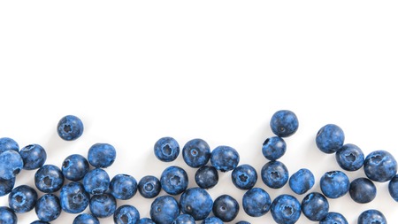 Creative layout with fresh ripe berries. Blueberry isolated on white background with copy space. Can use for your design, promo, social media. Top view. Bannerの写真素材