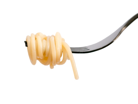Spaghetti on black fork isolated on white backgroundの写真素材
