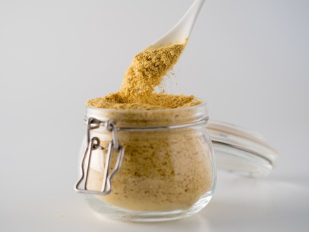 Nutritional inactive yeast in glass jarの写真素材