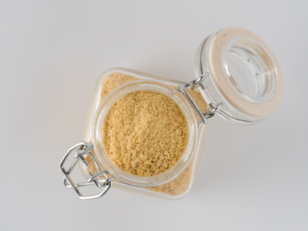 Nutritional inactive yeast in glass jarの写真素材