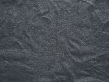 Gray linen crumpled tablecloth textureの写真素材