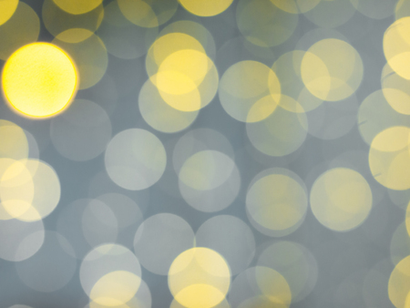 gold abstract background with bokeh defocused lightsの写真素材