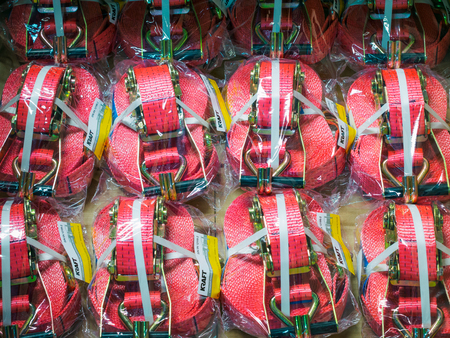 tensioning straps for securing cargo. Production of handling removable devices in warehouse of suspension cables manufacturingの写真素材