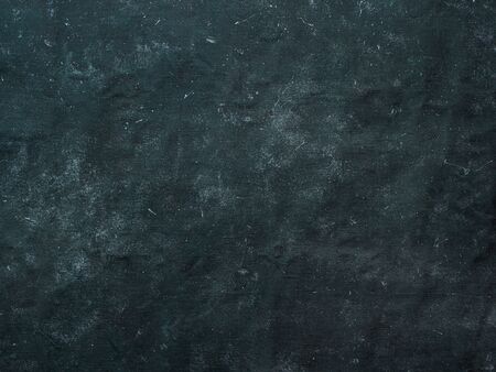 Dark mottled rustic background. Black blue canvas backdrop for design. Natural linen colored black...