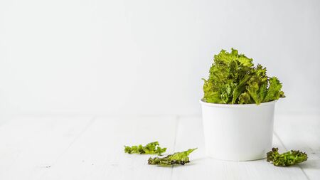 Homemade kale chips ready-to-eat, copy space leftの写真素材
