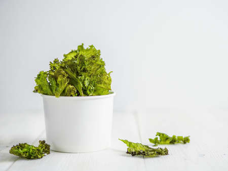 Homemade kale chips ready-to-eat, copy space leftの写真素材