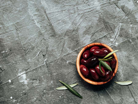red kalamata olives on gray, copy spaceの写真素材